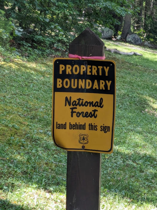 The sign for the national forest